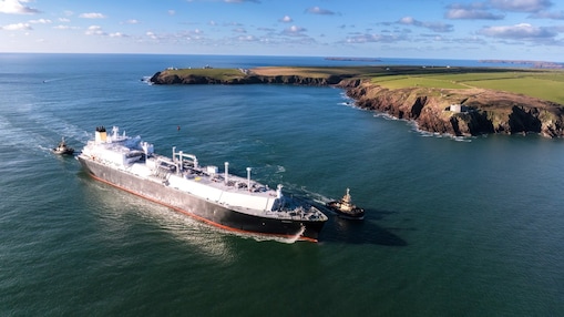 Magdala LNG tanker sailing passed a coastline.